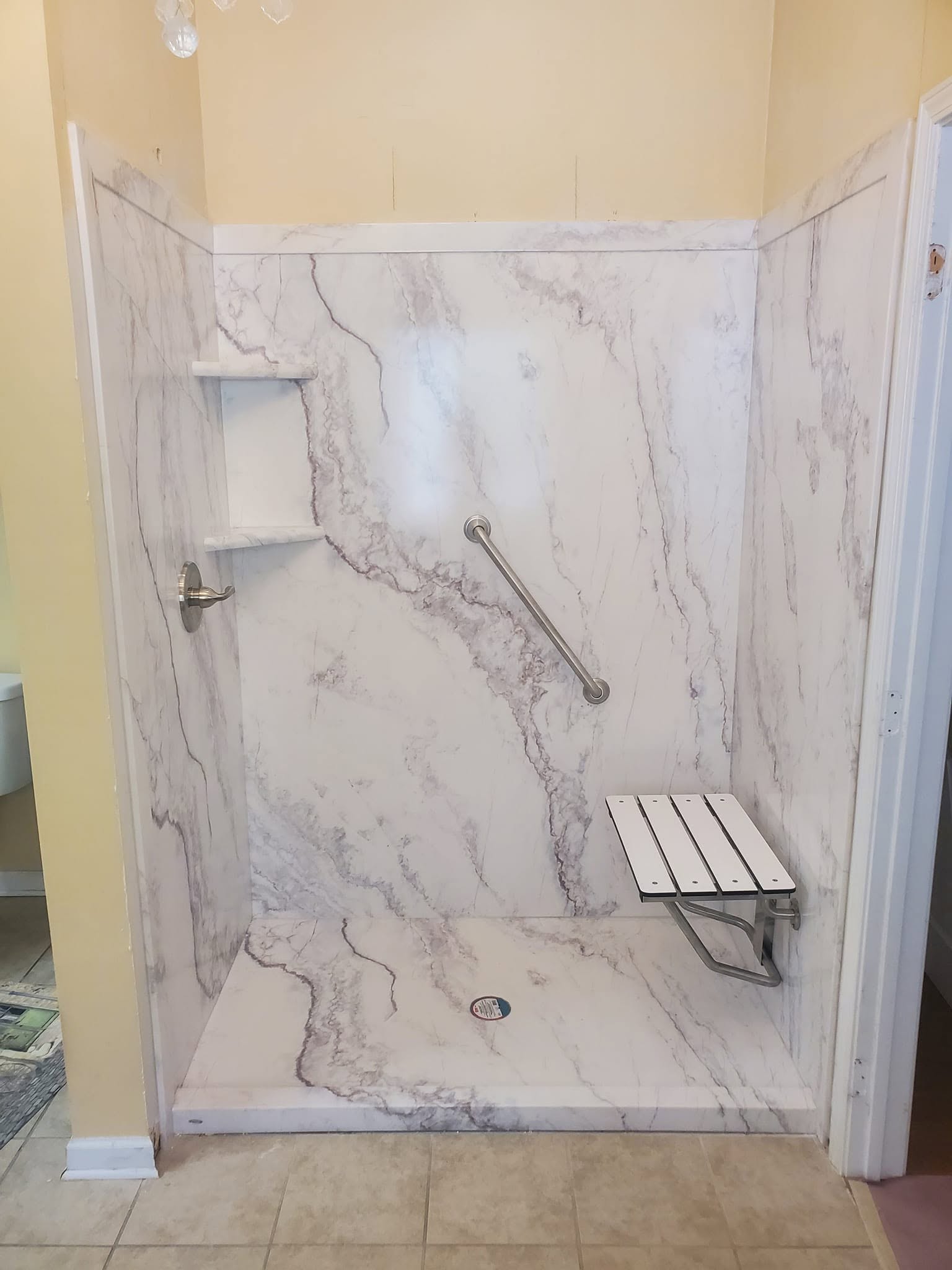 Surround set: Cultured marble walls, seat, and grab bar in